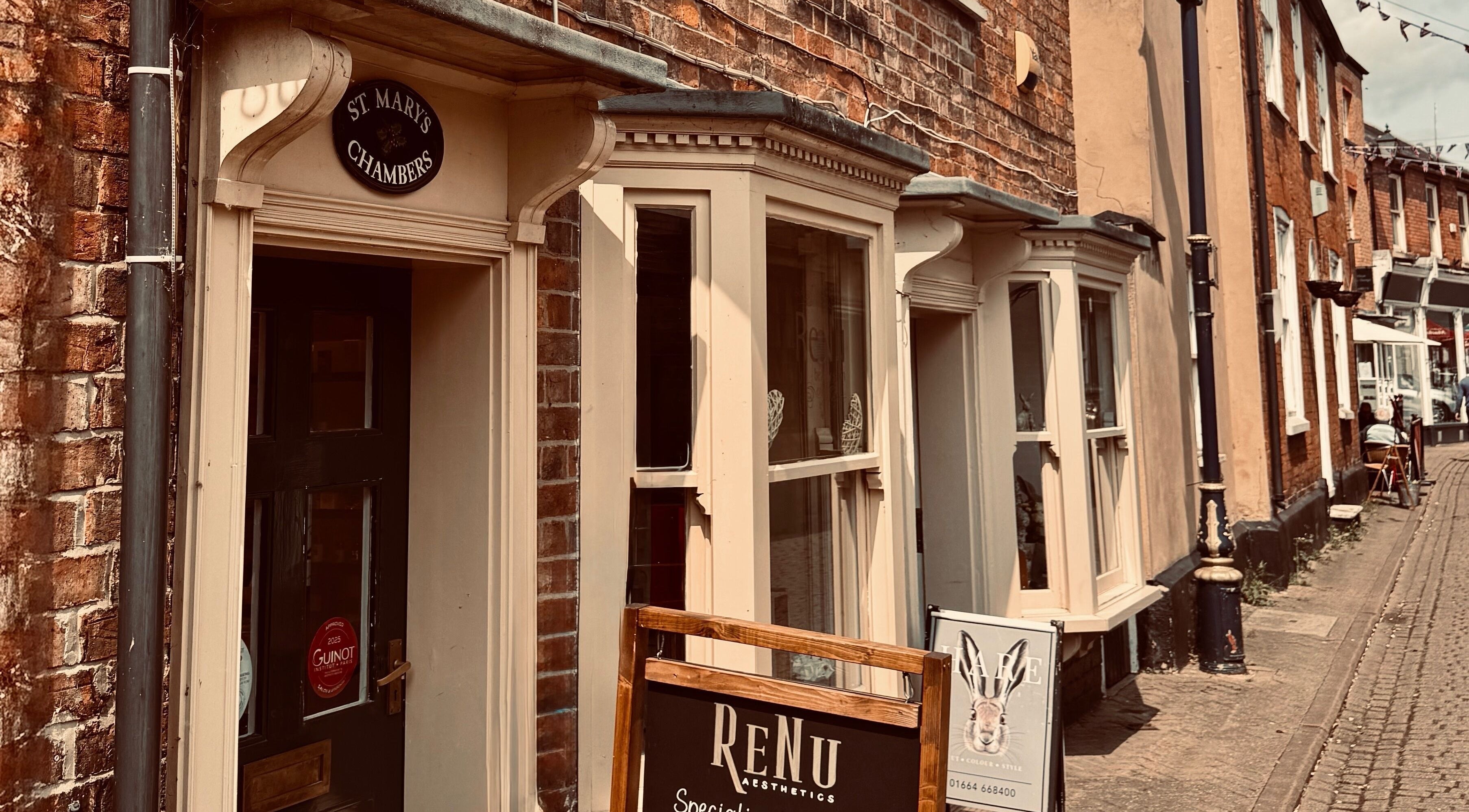 Exterior view of Renu Beauty on a quaint street in Melton Mowbray, England, GB, showcasing its welcoming brick facade.