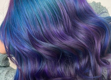 Vibrant blue and purple hair styling at Auburn Hair & Beauty in Barnham, England, GB.