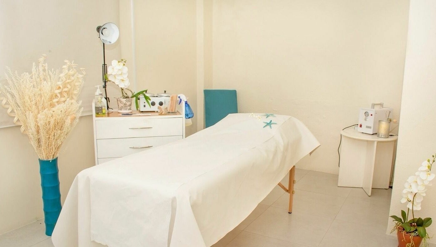 Relaxing treatment room at Ki West Spa, Bridgetown, Saint Michael, BB, featuring a tranquil massage table.