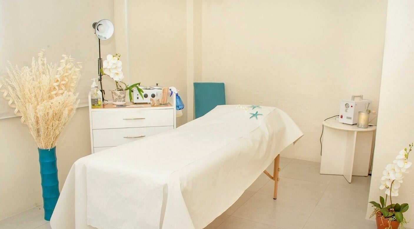 Relaxing treatment room at Ki West Spa, Bridgetown, Saint Michael, BB, featuring a tranquil massage table.