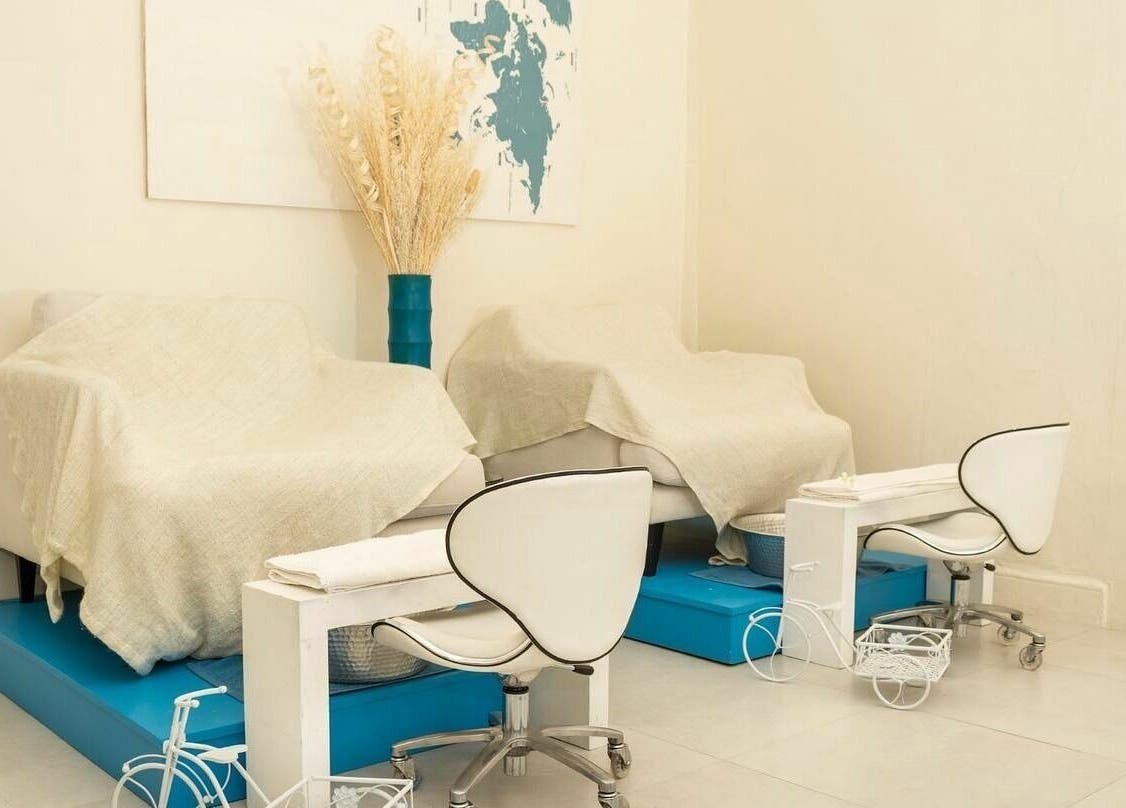 Relaxation area at Ki West Spa in Bridgetown, Saint Michael, BB, featuring cozy chairs and elegant decor.