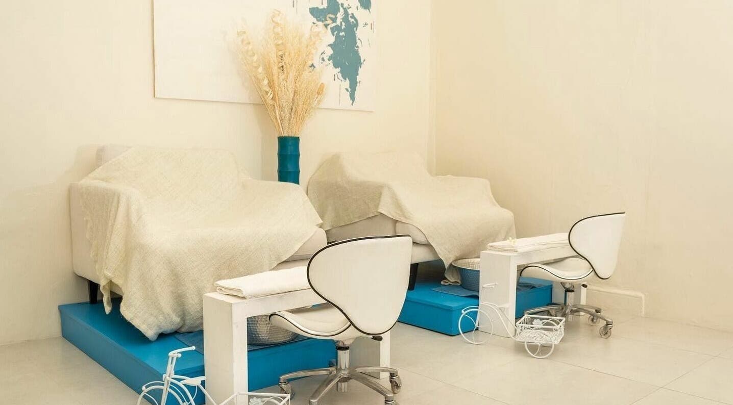 Relaxation area at Ki West Spa in Bridgetown, Saint Michael, BB, featuring cozy chairs and elegant decor.