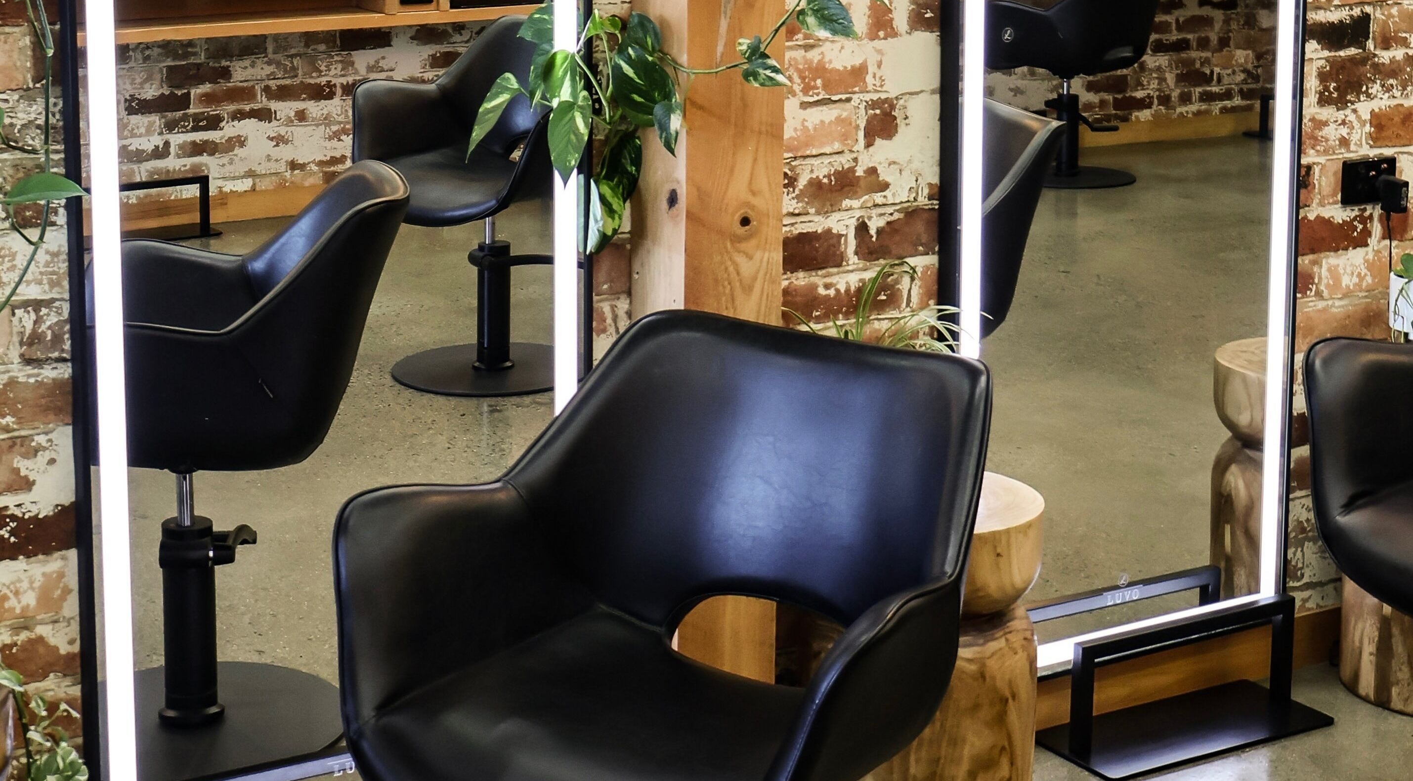 Modern salon chairs and mirrors at Evernew Hair Studio and Head Spa, Norman Gardens, Queensland, AU.