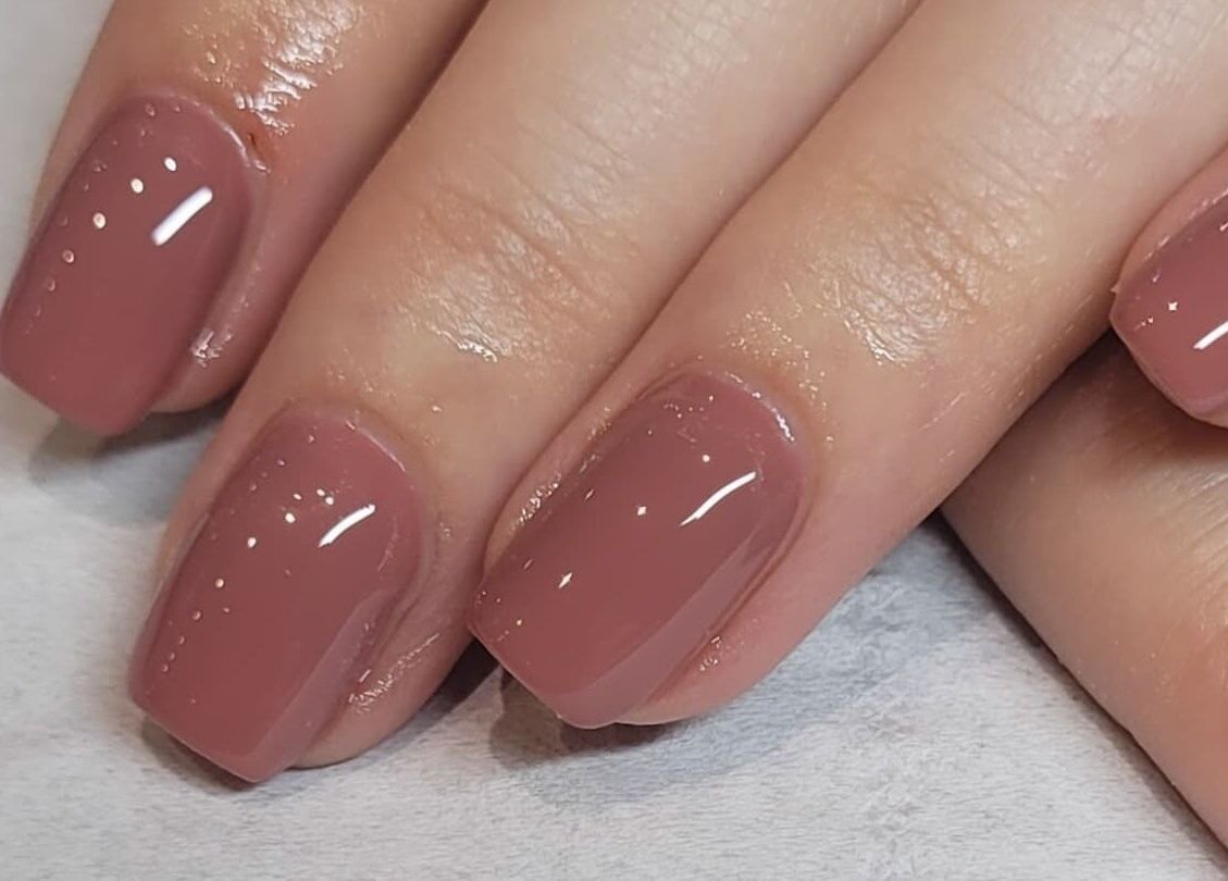 Elegant mauve manicure at Tina Jane in Urmston, England, GB, showcasing glossy nails.
