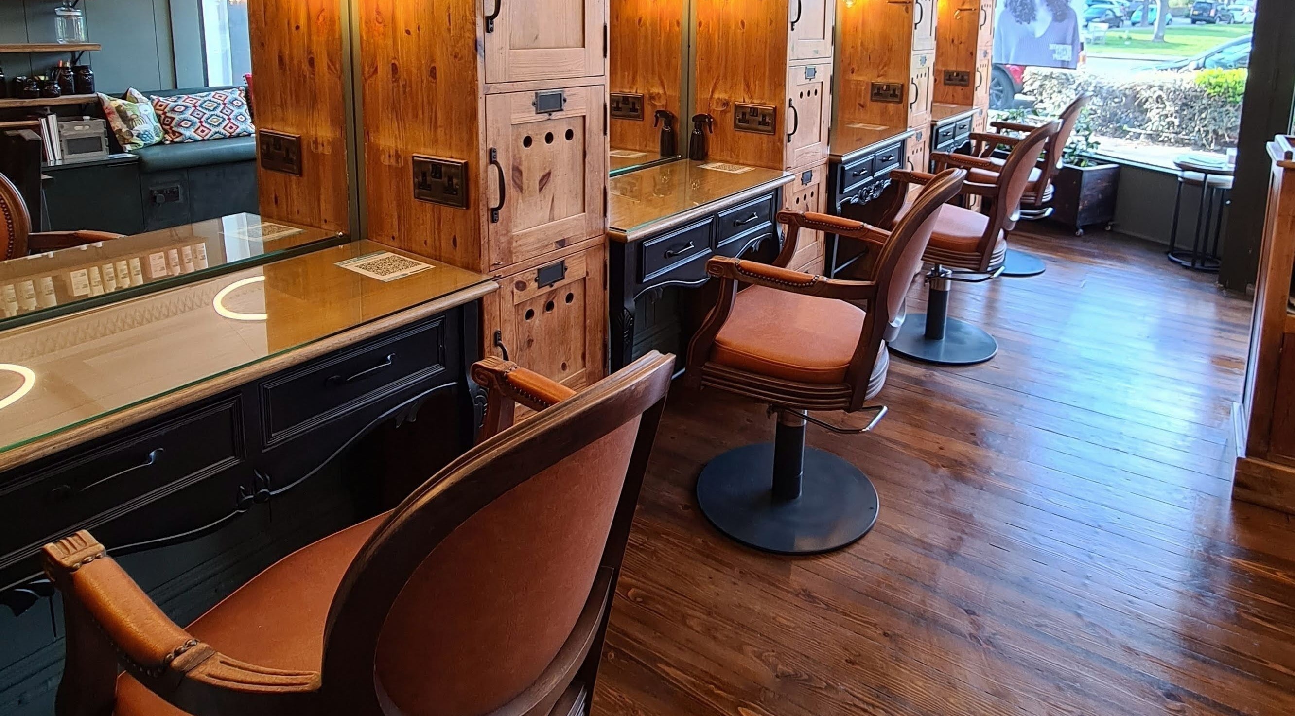 Sophisticated salon chairs and wood decor at Capelli, Essex, England, GB.