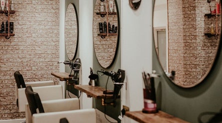 Elegant salon stations with mirrors at The Hair Boutique, Truro, England, GB.