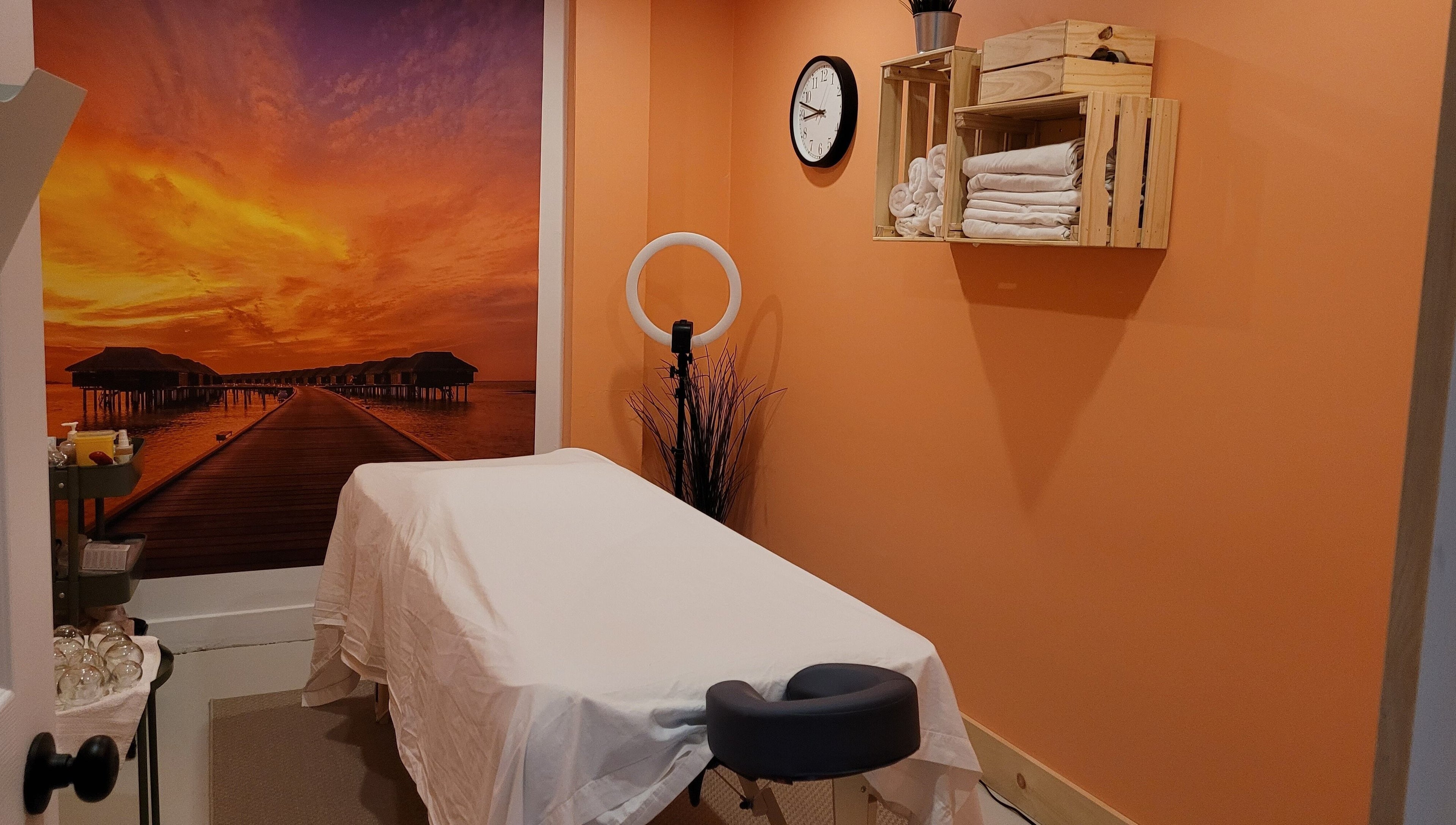 Massage room with sunset mural at Abalone Retreat, Stewiacke, Nova Scotia, CA.