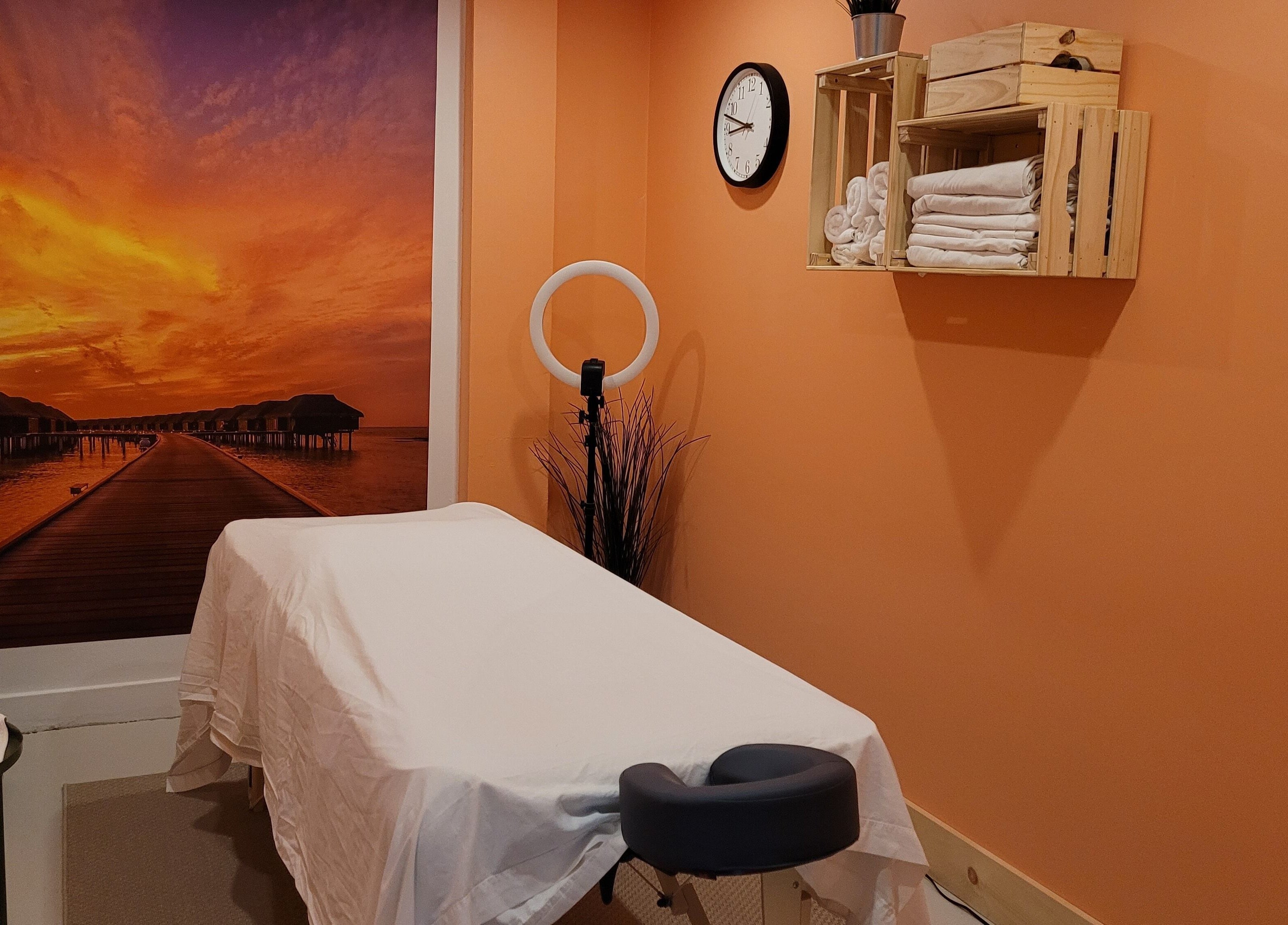 Massage room with sunset mural at Abalone Retreat, Stewiacke, Nova Scotia, CA.