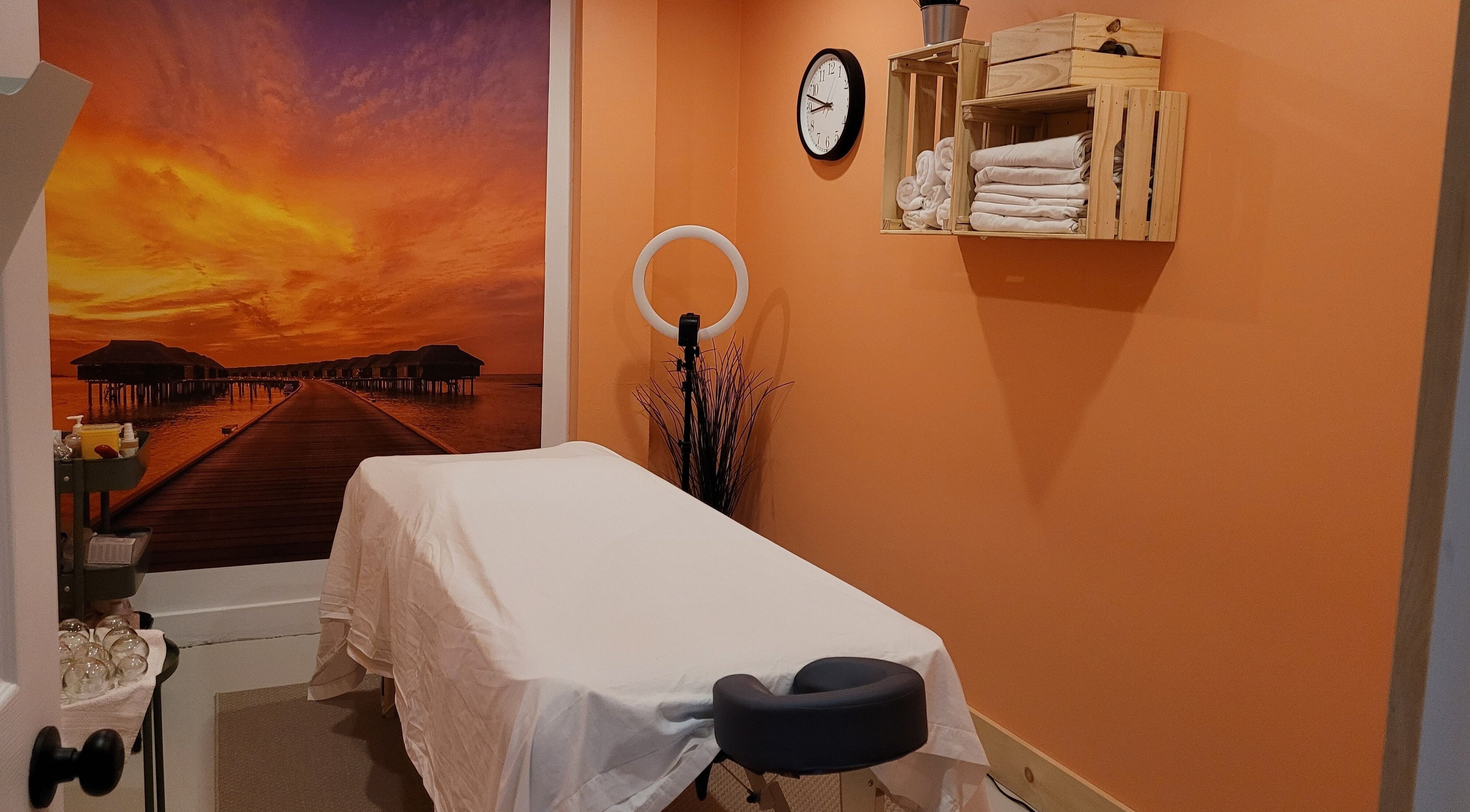 Massage room with sunset mural at Abalone Retreat, Stewiacke, Nova Scotia, CA.