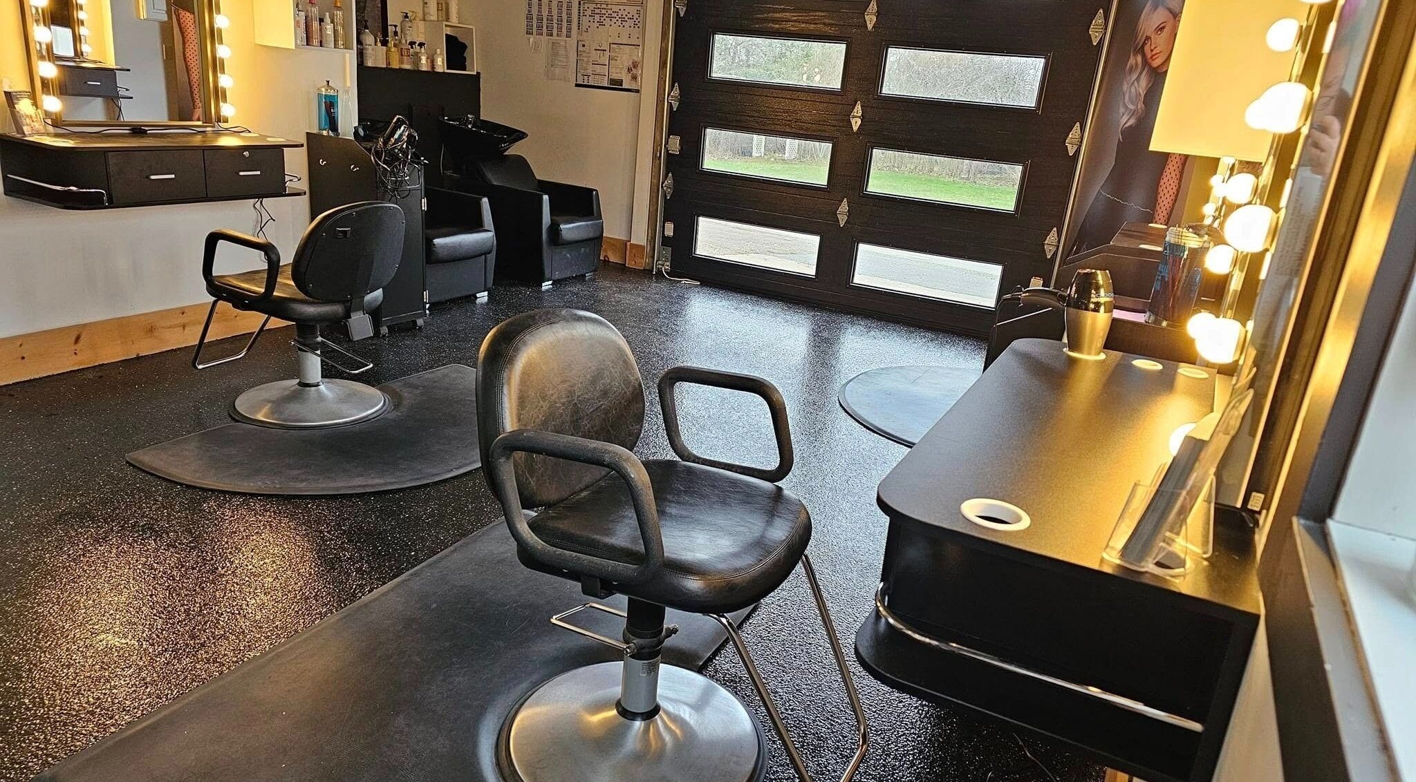 Elegant salon space at Abalone Retreat, Stewiacke, Nova Scotia, CA with modern chairs and illuminated mirrors.