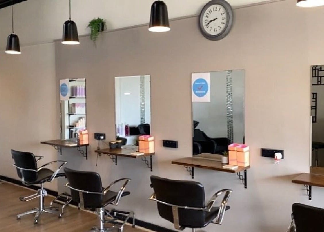 Modern salon chairs and mirrors at Envious Hair And Beauty, Figtree, New South Wales, AU.