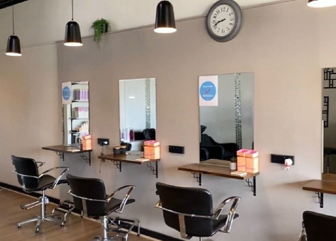 Modern salon chairs and mirrors at Envious Hair And Beauty, Figtree, New South Wales, AU.