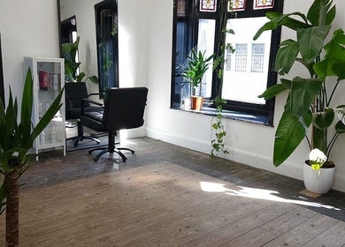 Chic interior of The Watt in Downham Market, England, GB with lush greenery and modern decor.