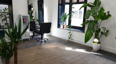 Chic interior of The Watt in Downham Market, England, GB with lush greenery and modern decor.