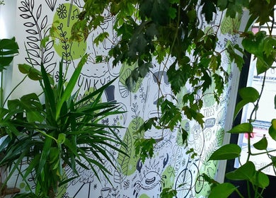 Lush greenery and artistic mural at The Watt, Downham Market, England, GB, creating a serene ambiance.
