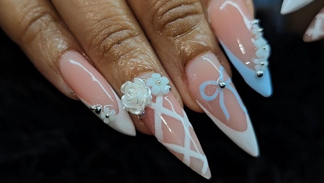 Intricate nail art design featuring floral accents at The Wild Dragonfly Spa, Tunapuna/Piarco Regional Corporation, TT.