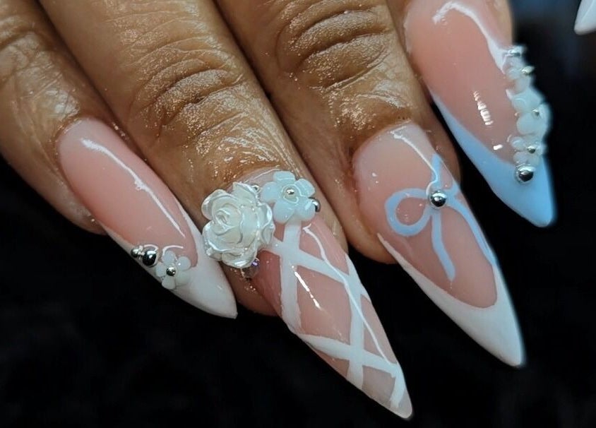 Intricate nail art design featuring floral accents at The Wild Dragonfly Spa, Tunapuna/Piarco Regional Corporation, TT.