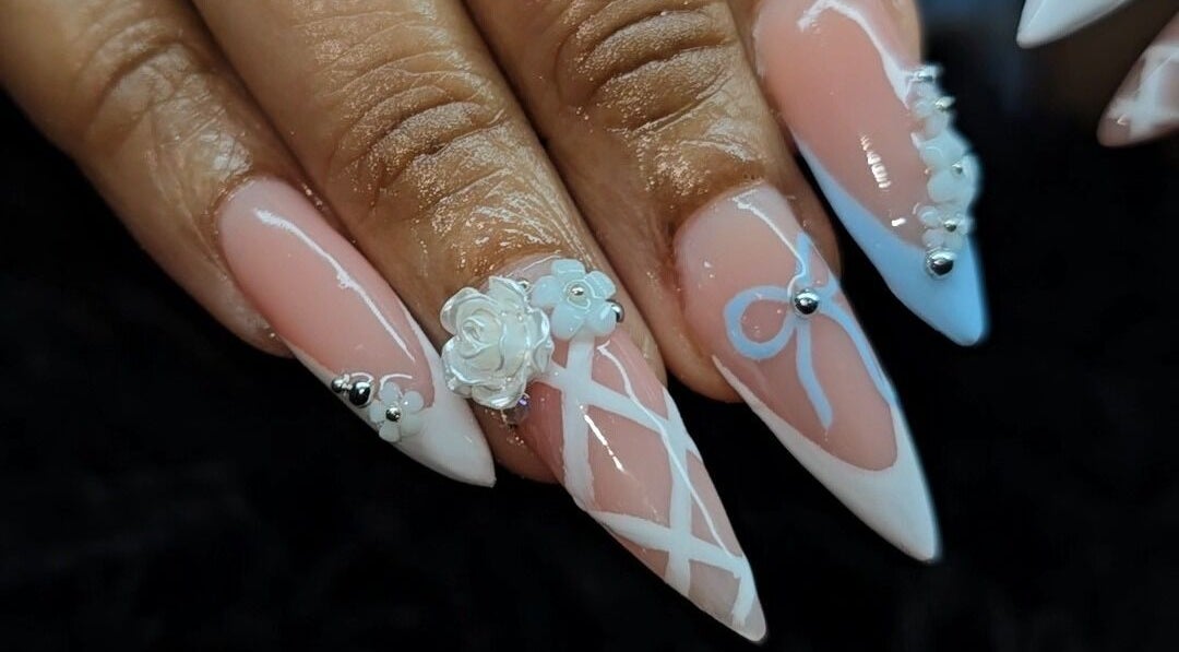 Intricate nail art design featuring floral accents at The Wild Dragonfly Spa, Tunapuna/Piarco Regional Corporation, TT.