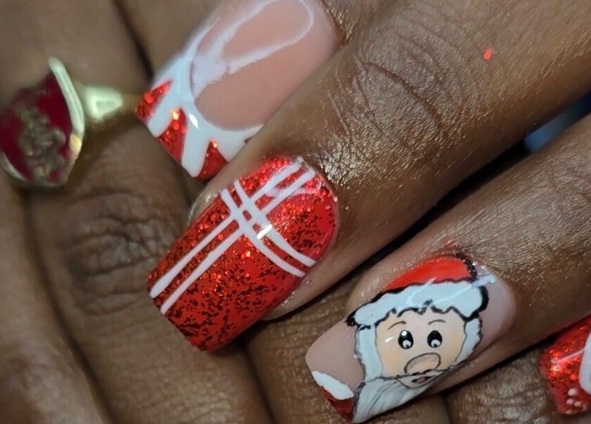 Festive nail art with Santa design at The Wild Dragonfly Spa, Tunapuna/Piarco Regional Corporation, TT.
