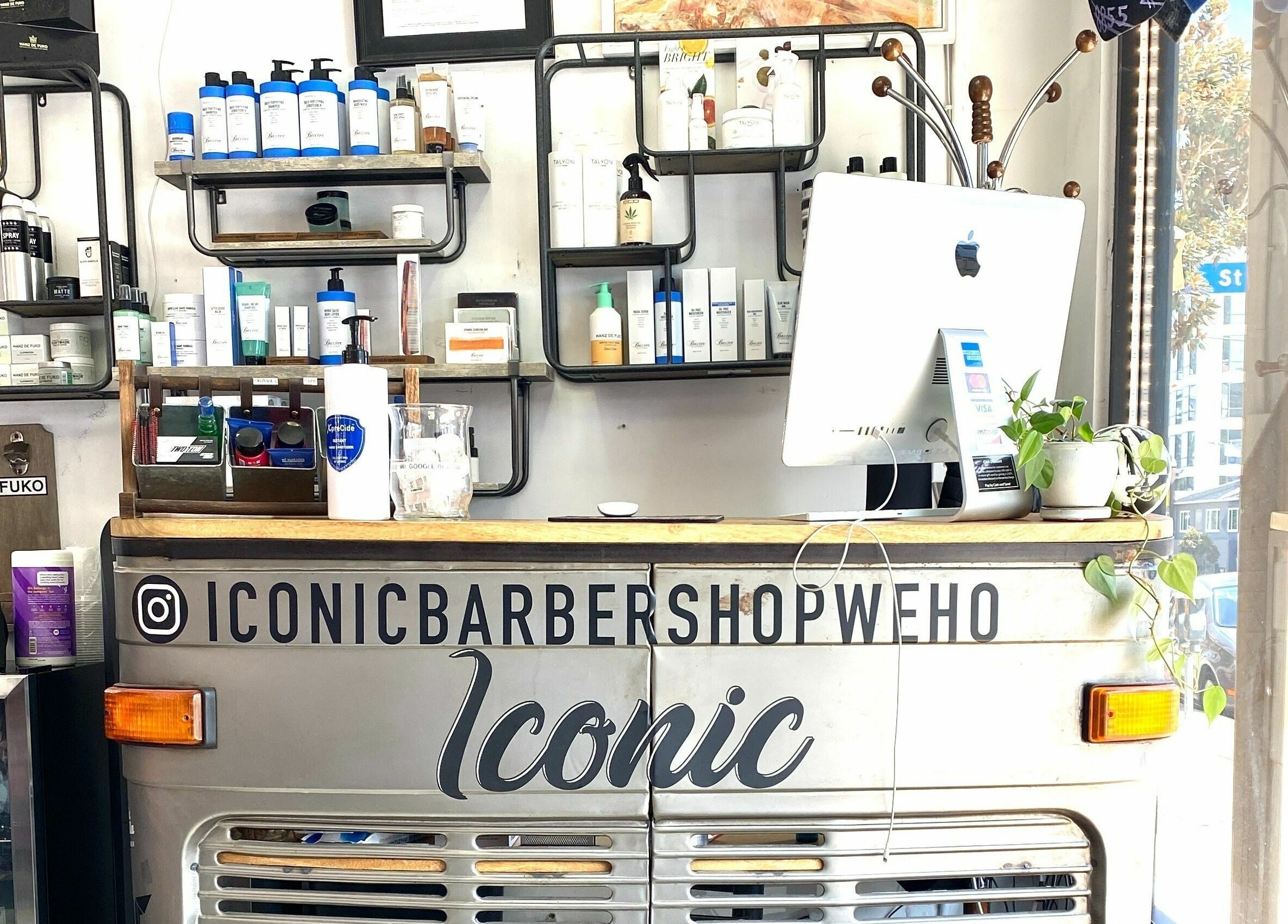 Front desk of Iconic Barbershop West Hollywood, showcasing sleek design and products in West Hollywood, California, US.