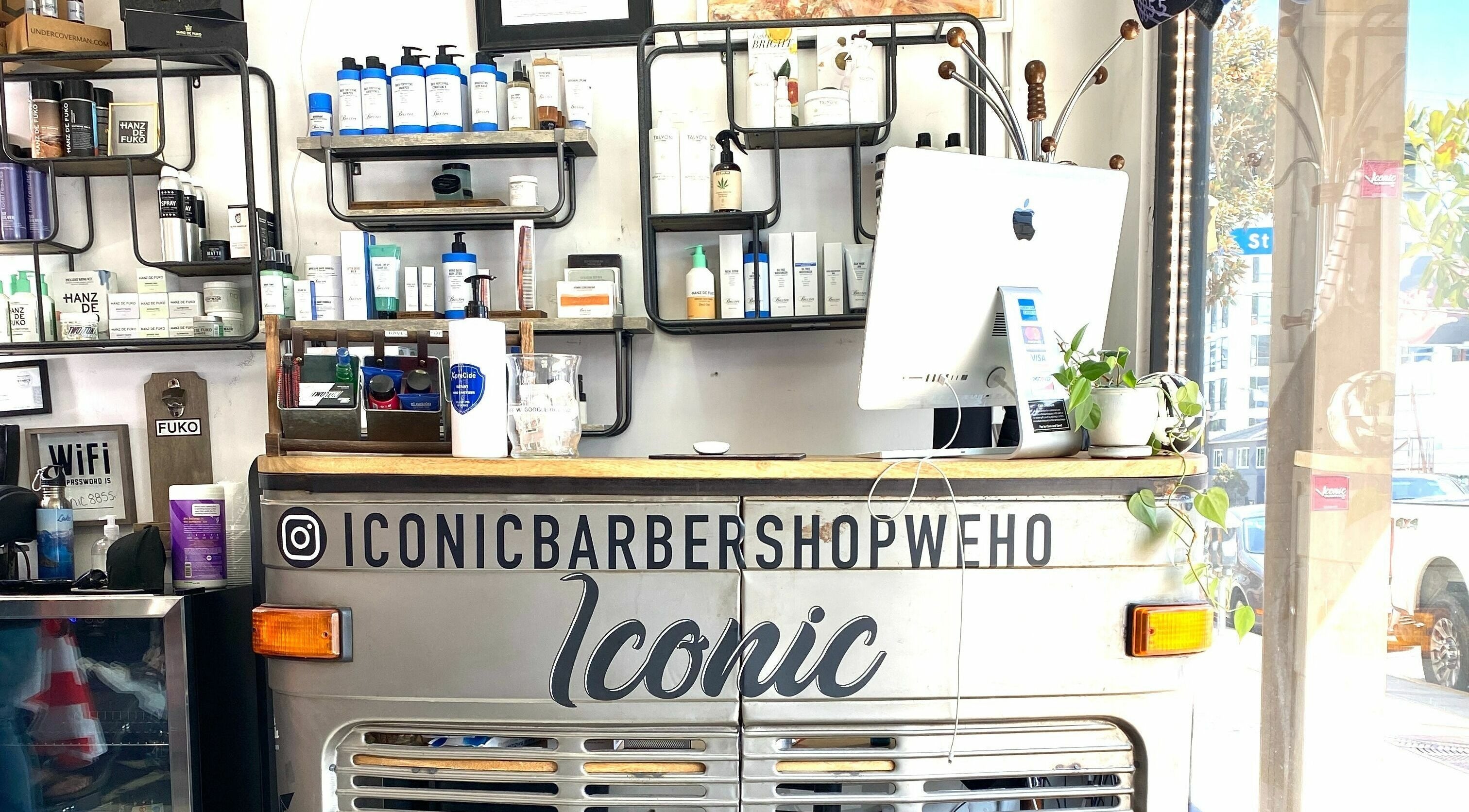 Front desk of Iconic Barbershop West Hollywood, showcasing sleek design and products in West Hollywood, California, US.