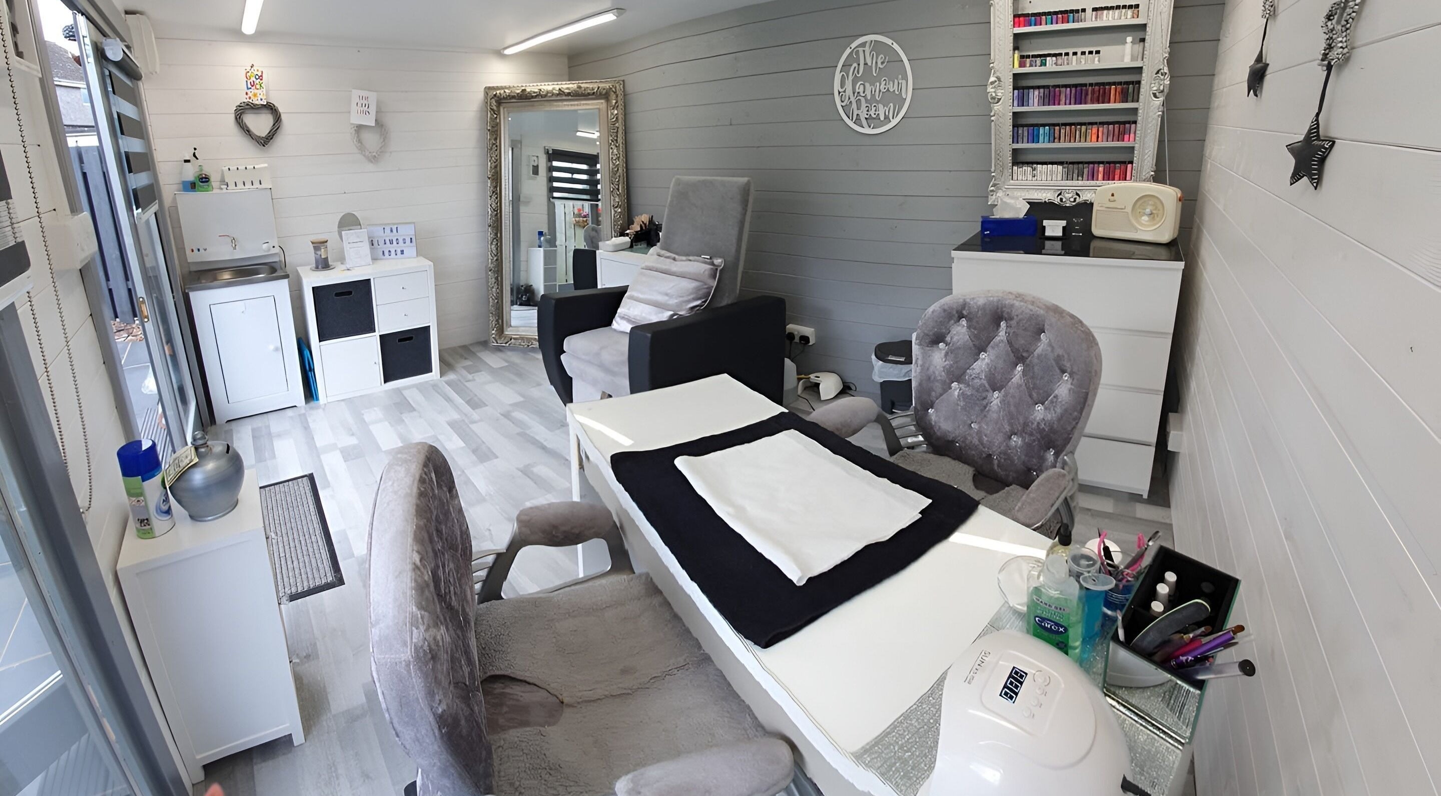 Elegant interior of The Glamour Room, Stonehaven, Scotland, GB, featuring stylish nail care stations.