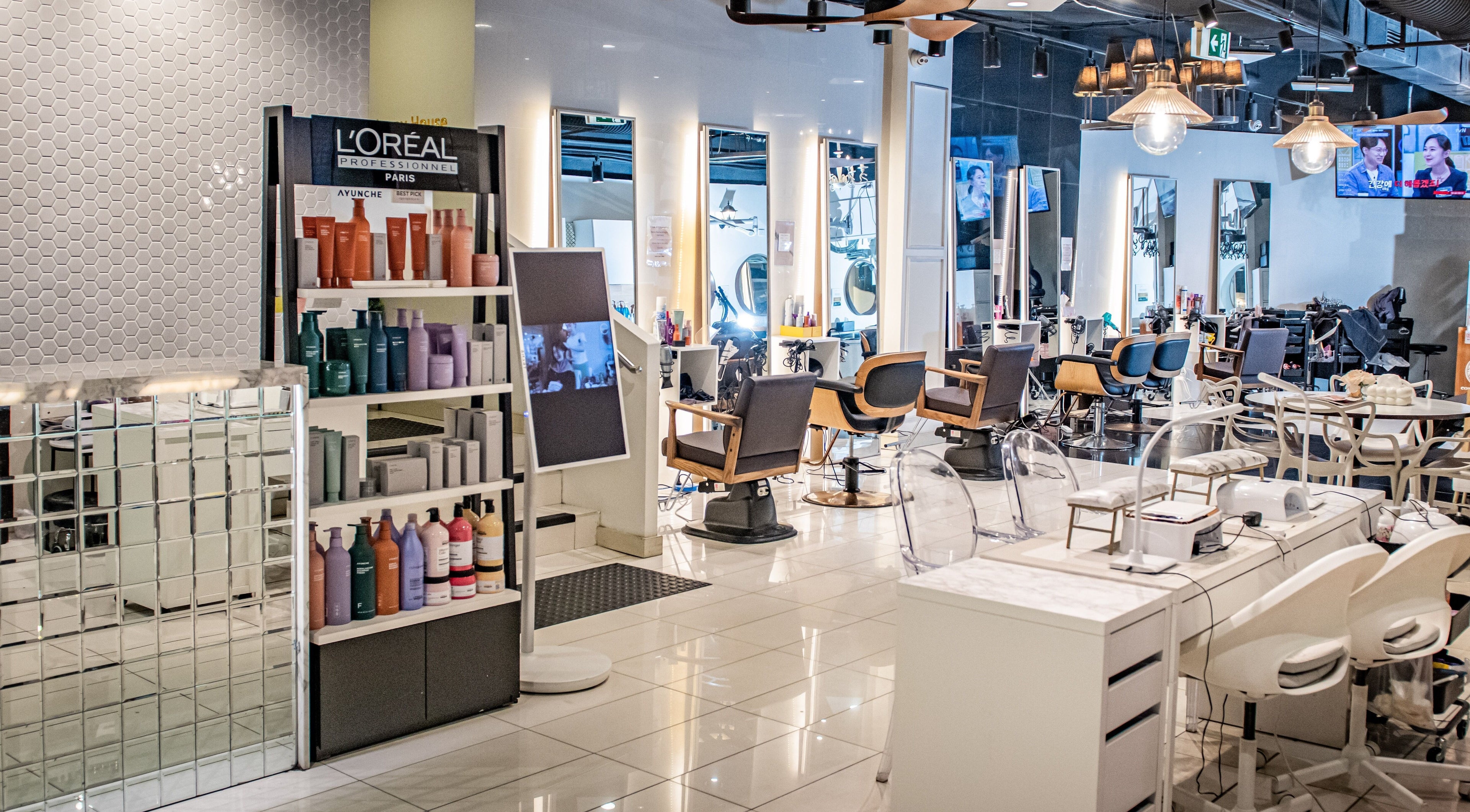 Modern salon interior at Jennys House the beginning, Eastwood, New South Wales, AU, featuring styling stations.