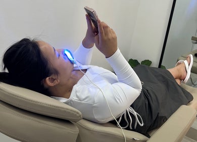 Client enjoying teeth whitening at Chrystal Clear Smile - Sans Souci, New South Wales, AU.