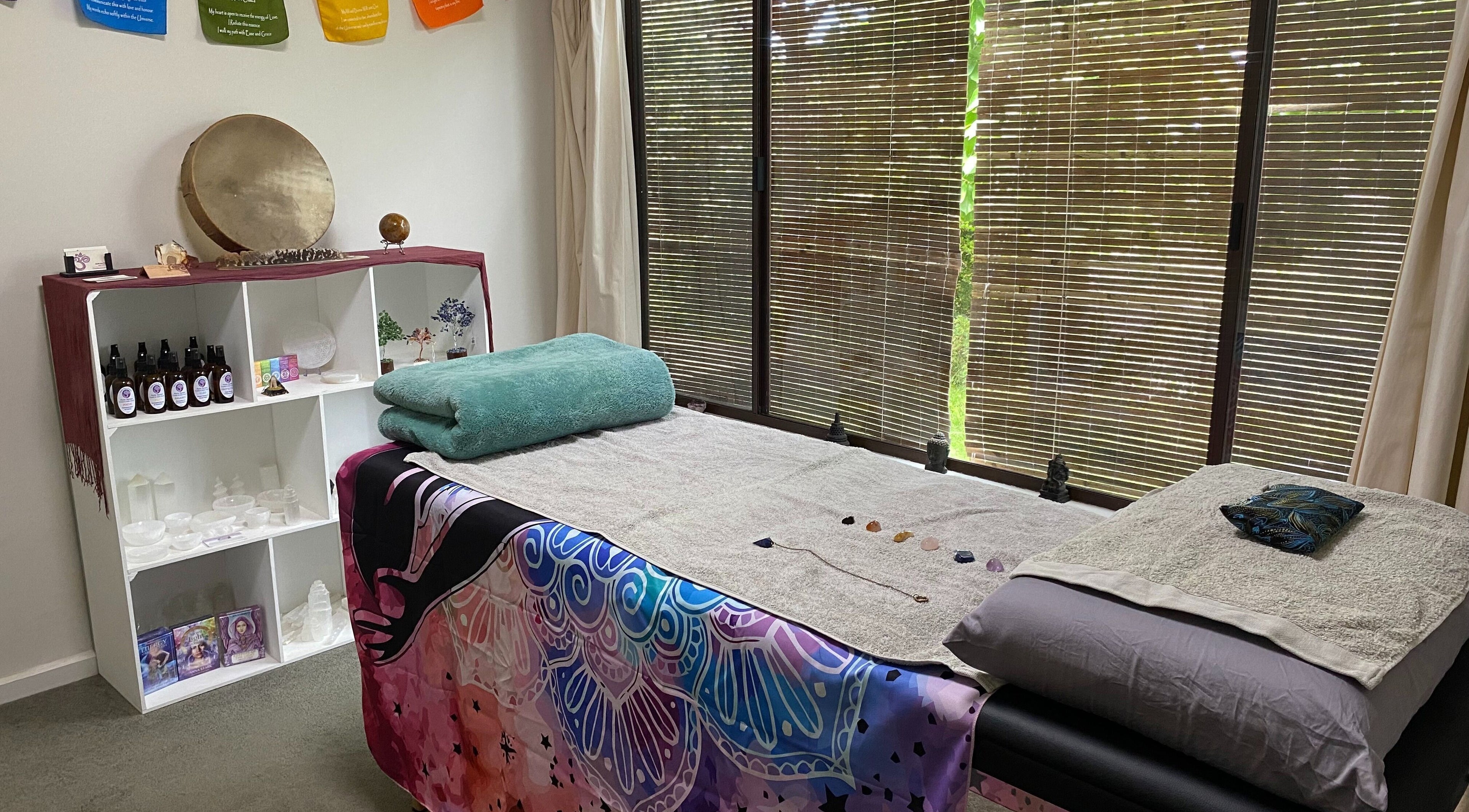 Calming reiki therapy room at Earth Aya Energy - Reiki, Melbourne, Victoria, AU with massage table and spiritual decor.