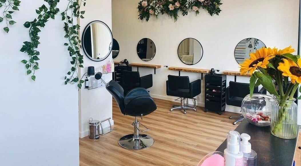 Elegant interior of The Beauty Lounge by Laura in Lossiemouth, Scotland, GB, showcasing sleek styling stations.