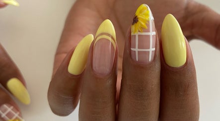 Bright yellow nail art with sunflower design at Nails and Things, Johannesburg, Gauteng, ZA.