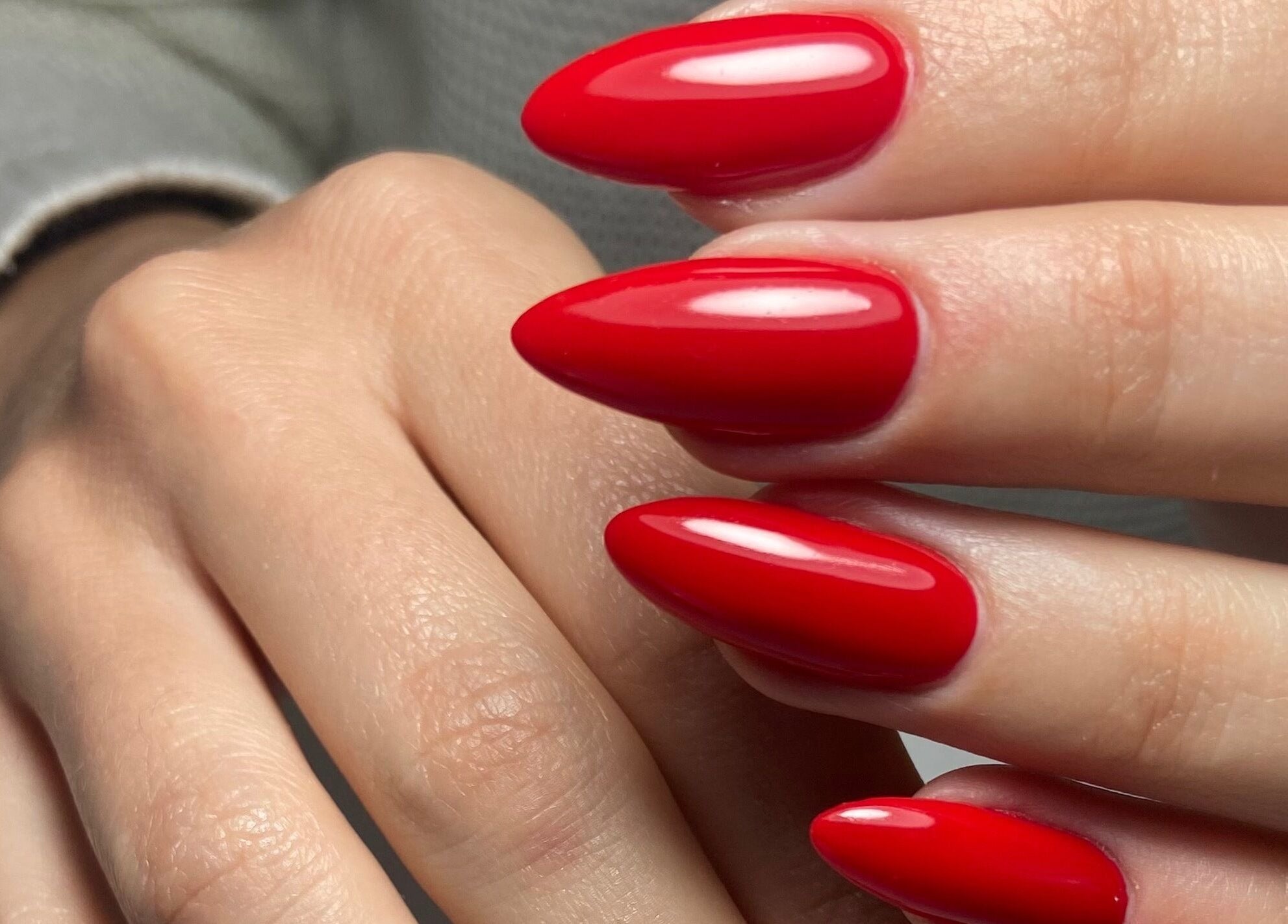 Bright red manicured nails at Nails and Things in Johannesburg, Gauteng, ZA.