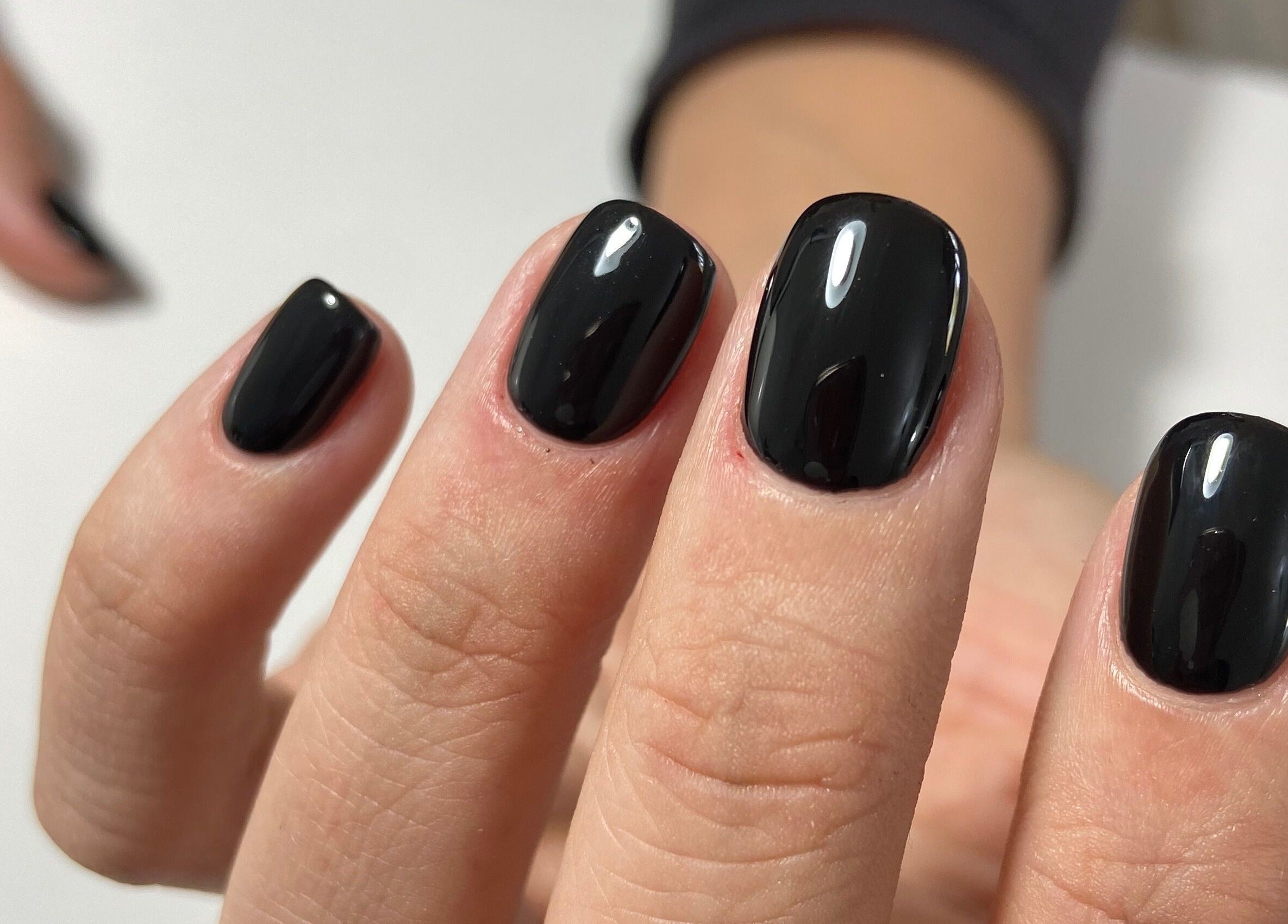 Close-up of chic black manicure at Nails and Things in Johannesburg, Gauteng, ZA.