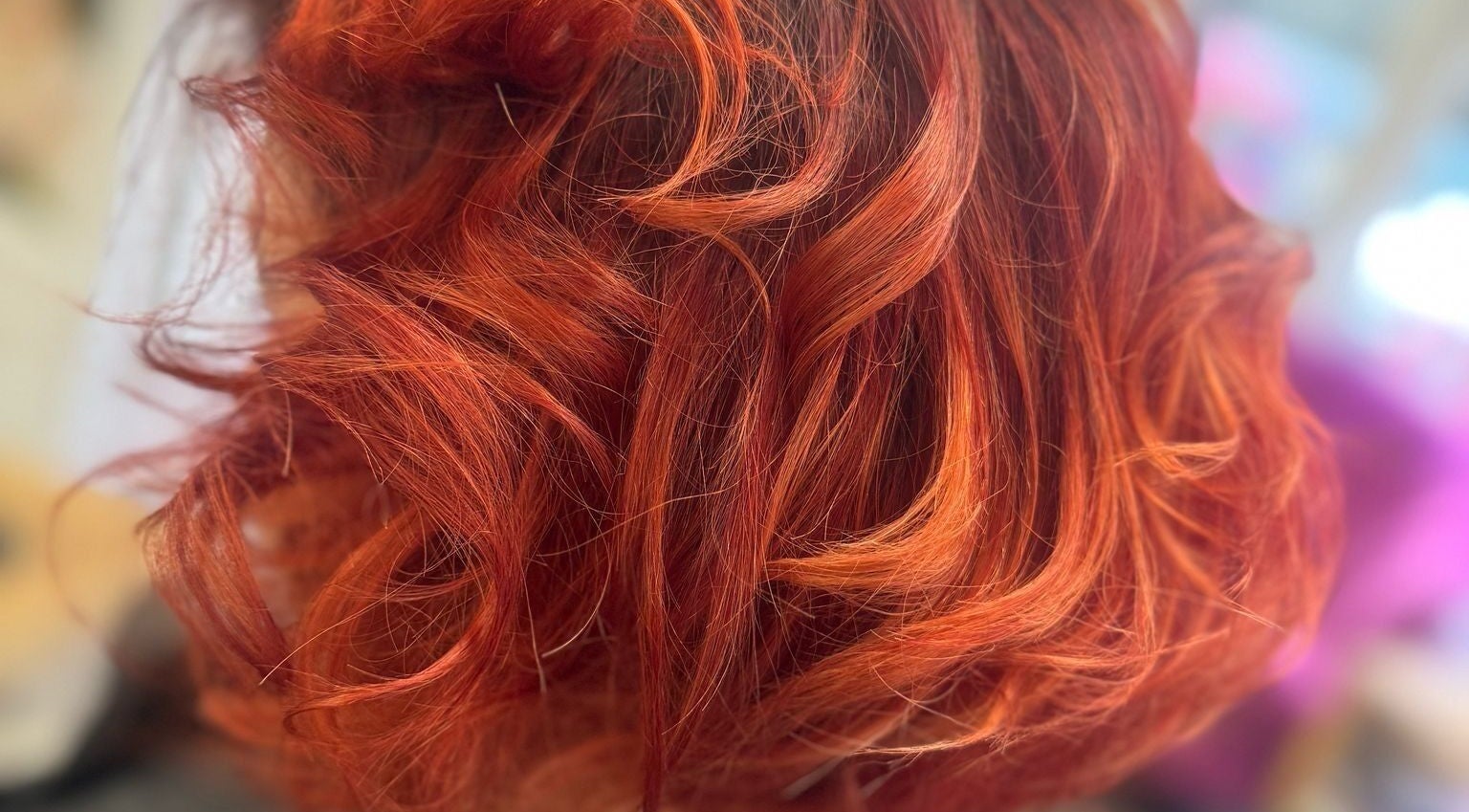 Vibrant red curls hairstyle at Angela Lewis - Architects of Hair, Gatley, England, GB.