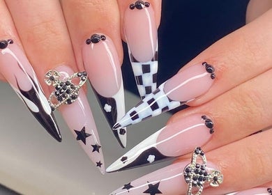 Elegant nail art at Angela Lewis - Architects of Hair, Gatley, England, GB featuring intricate black and white designs.