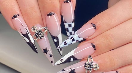 Elegant nail art at Angela Lewis - Architects of Hair, Gatley, England, GB featuring intricate black and white designs.