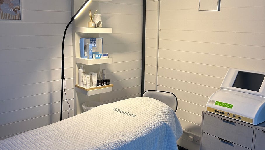 Omg Beauty treatment room in Alva, Scotland, GB, with relaxing decor and skincare products on display.