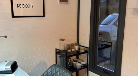 A relaxing corner at Omg Beauty, Alva, Scotland, GB featuring stylish decor and refreshments.