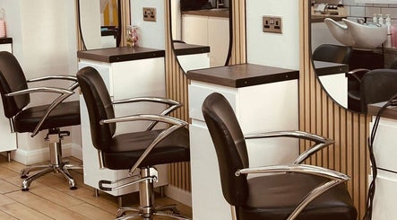 Chic salon chairs at Clip'so March in March, England, GB. Modern beauty space with sleek design.