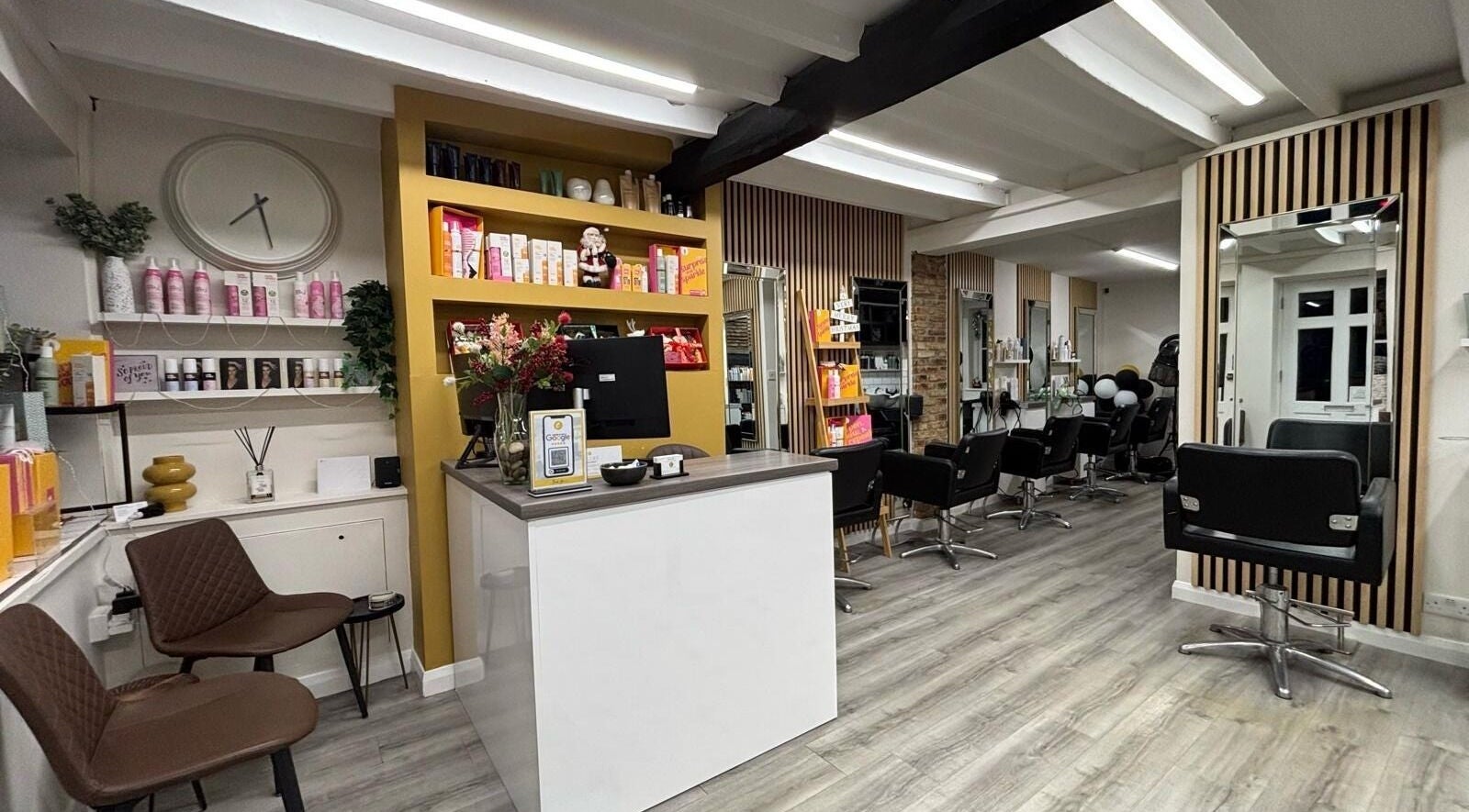 Stylish interior of Clip’so Ely salon in Ely, England, GB featuring modern decor and salon chairs.