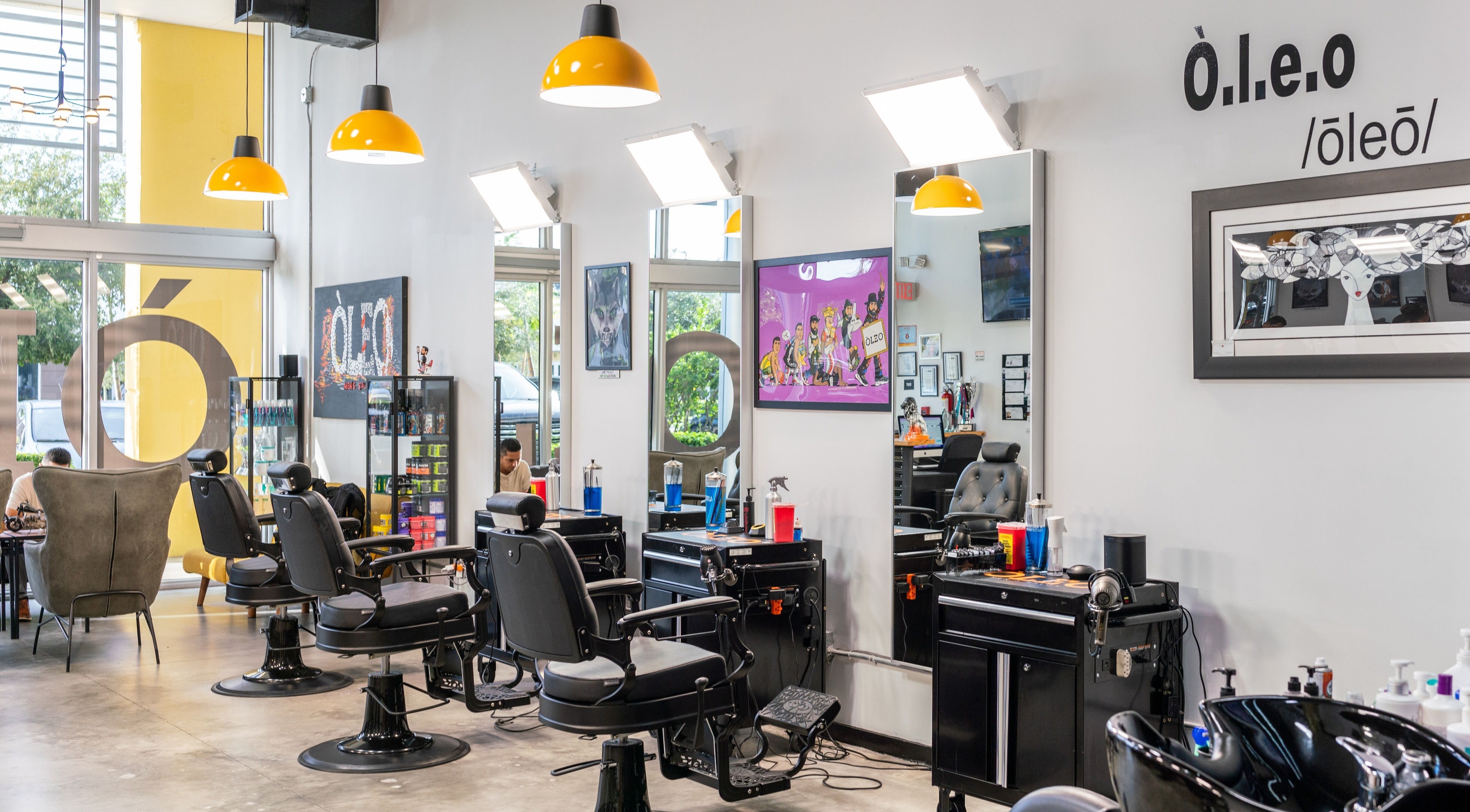 Inside Òleo Men's Salon in Miami, Florida, US, showcasing modern barber chairs and stylish decor.