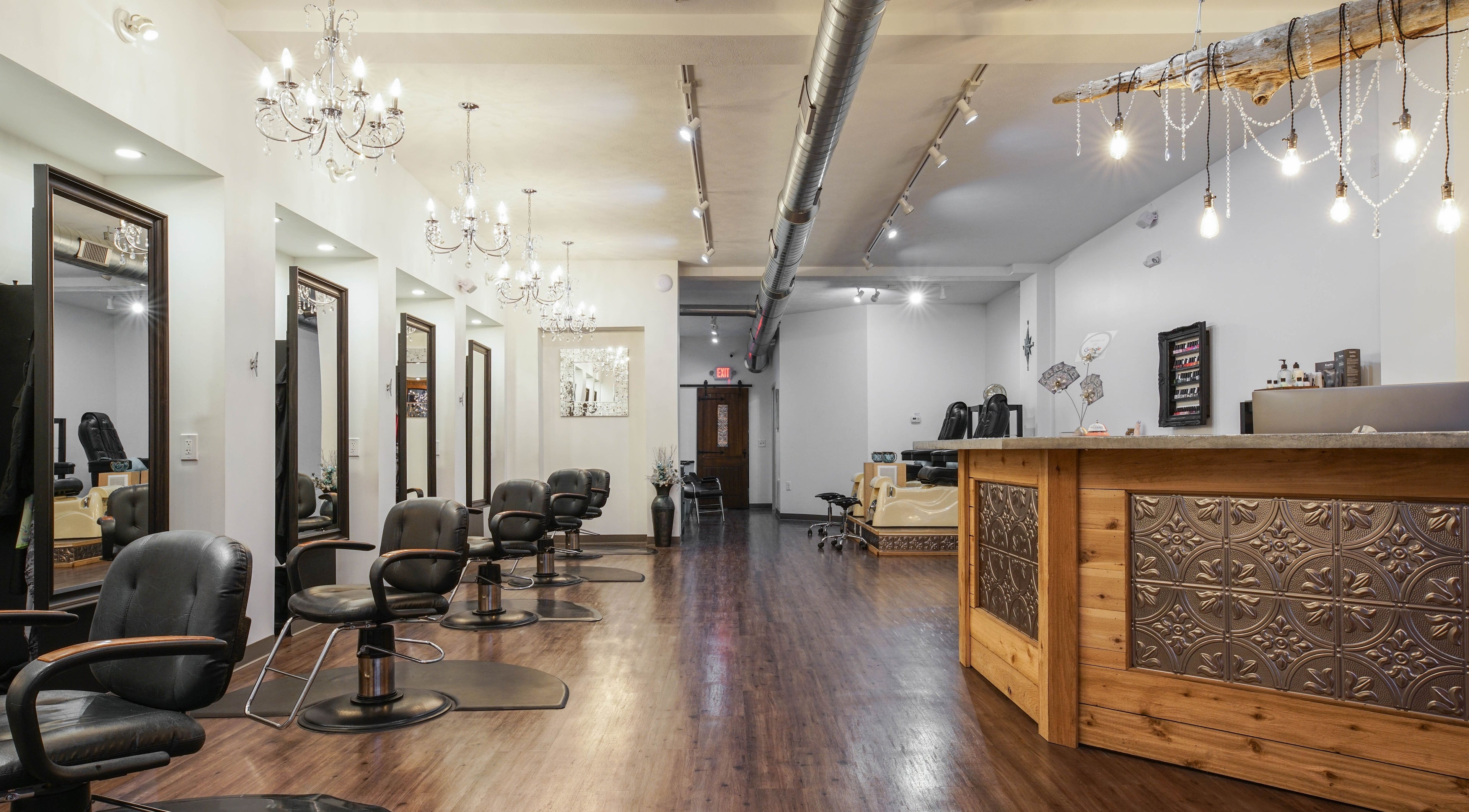 Chic interior of Dockside Salon & Day Spa in Muskegon, Michigan, US, featuring plush chairs and stylish lighting.