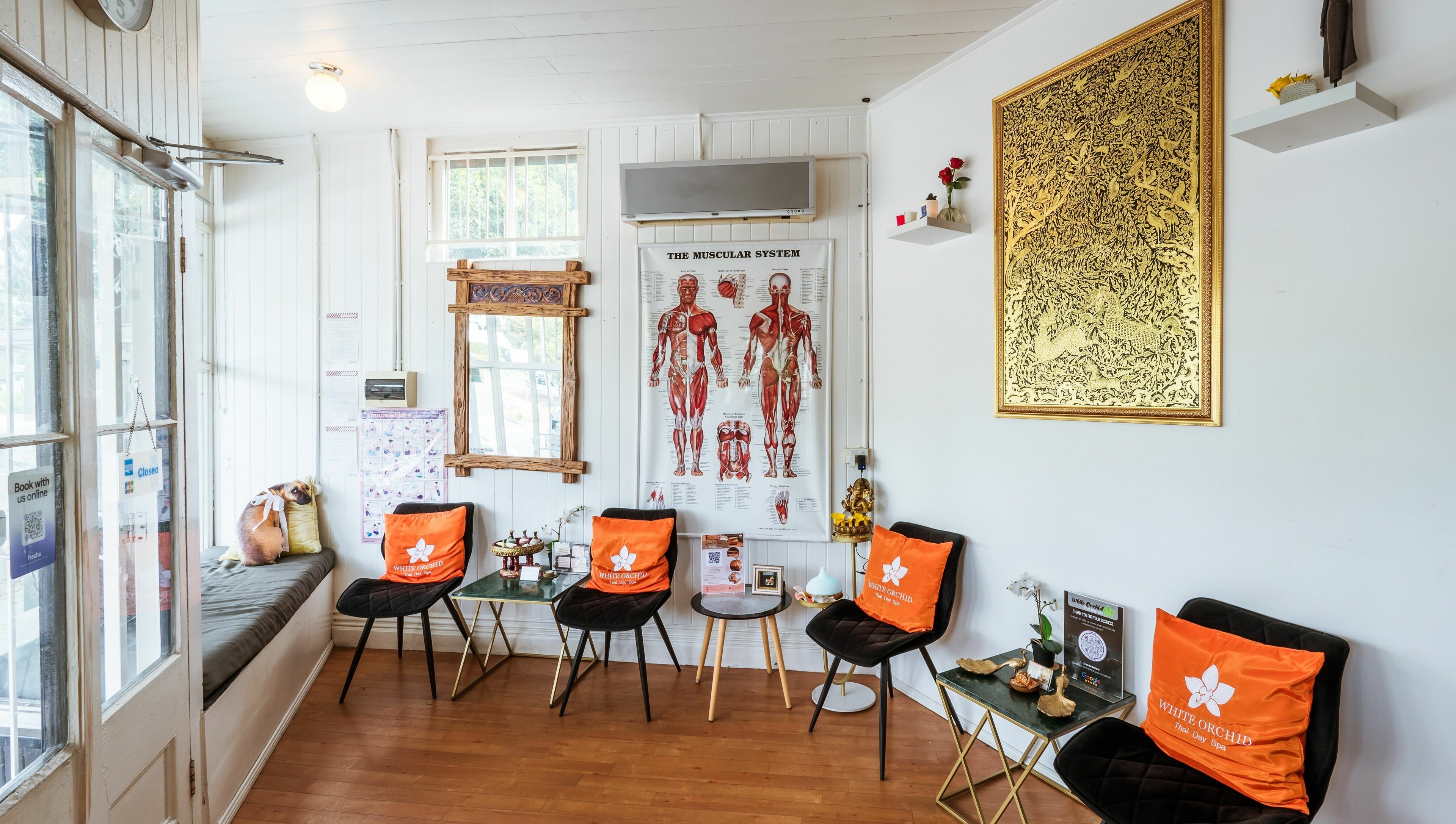 Relaxing lobby at White Orchid Thai Day Spa in Toowong, Queensland, AU, showcasing cozy seating and decor.