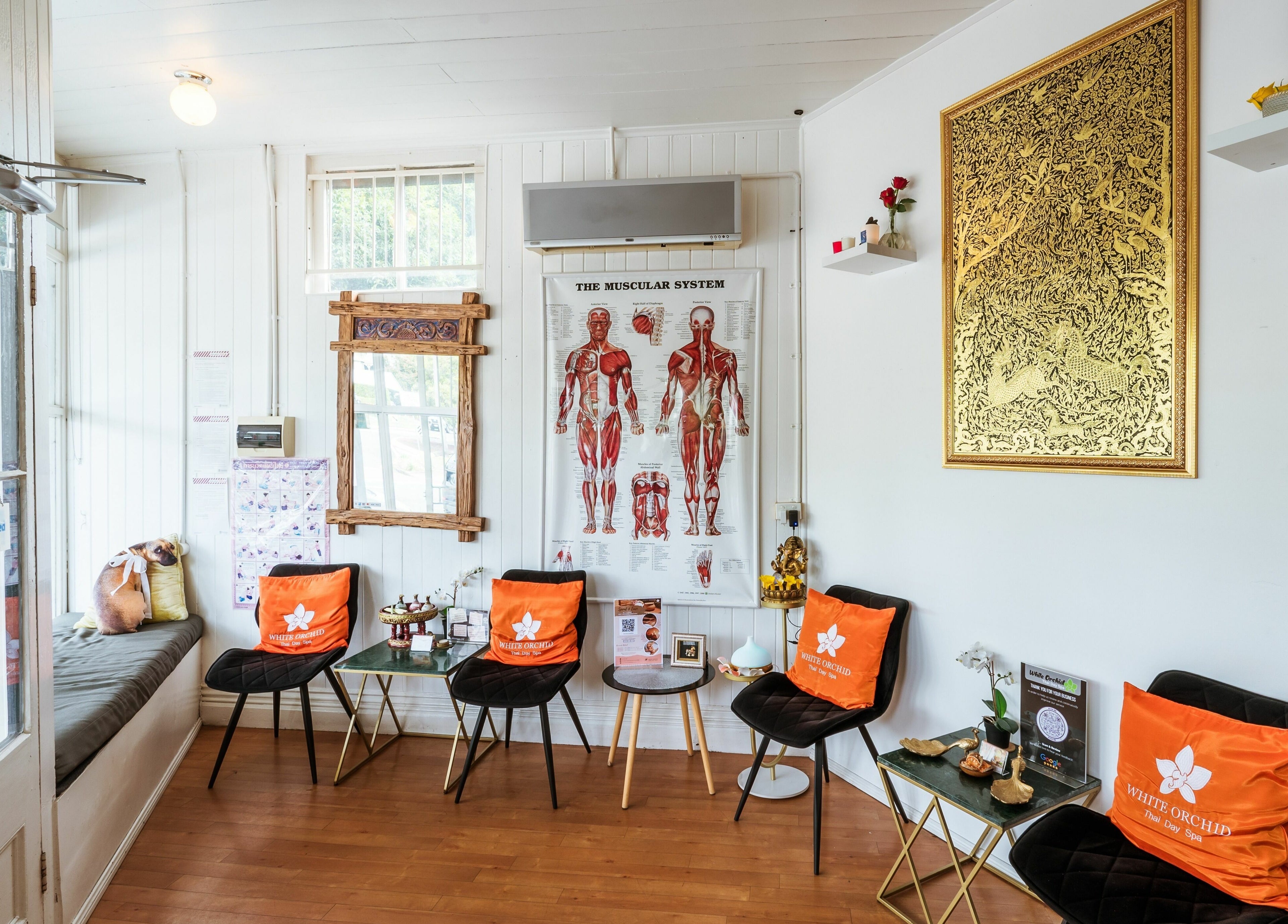 Relaxing lobby at White Orchid Thai Day Spa in Toowong, Queensland, AU, showcasing cozy seating and decor.