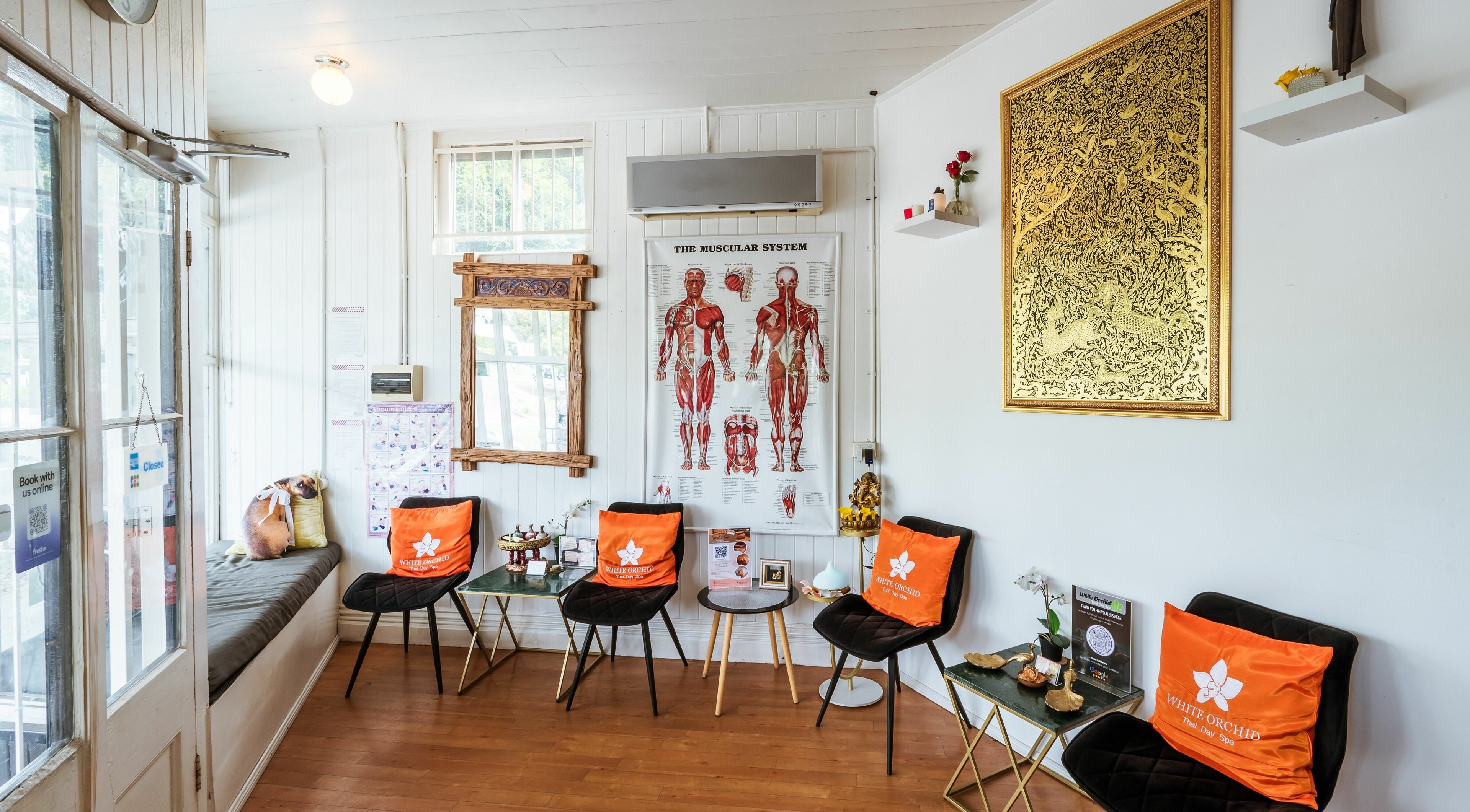 Relaxing lobby at White Orchid Thai Day Spa in Toowong, Queensland, AU, showcasing cozy seating and decor.