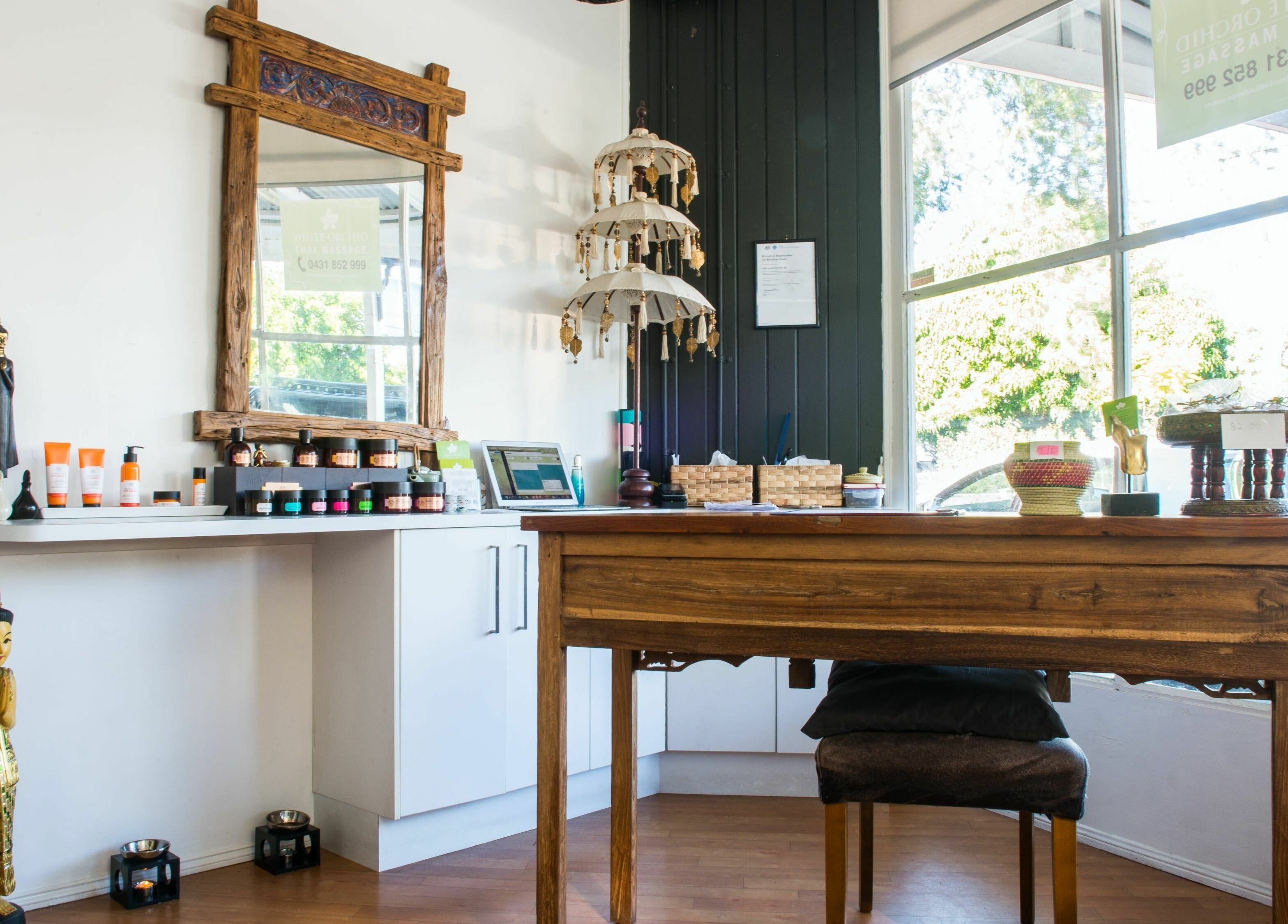 Reception area at White Orchid Thai Day Spa in Toowong, Queensland displaying products and decor.