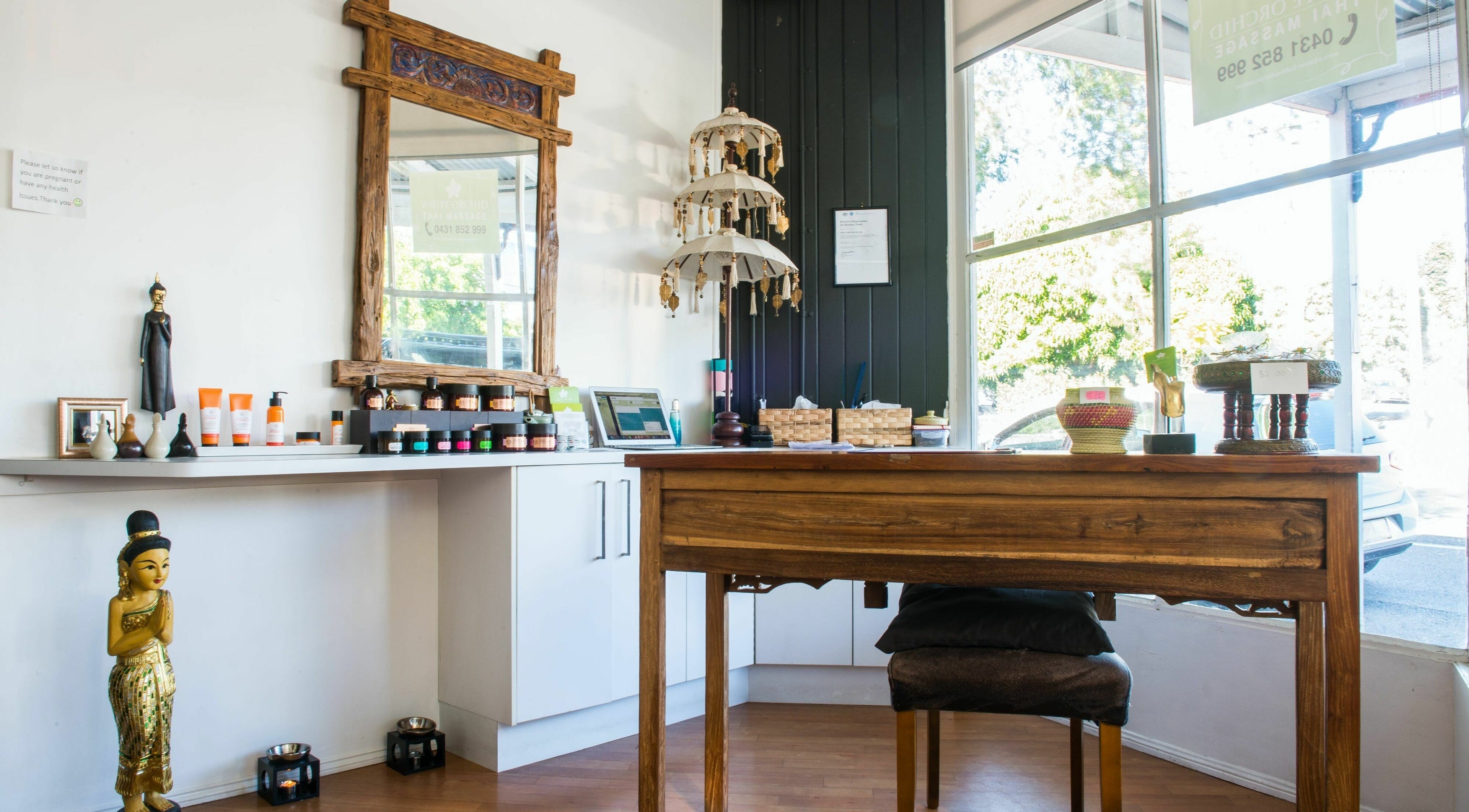 Reception area at White Orchid Thai Day Spa in Toowong, Queensland displaying products and decor.