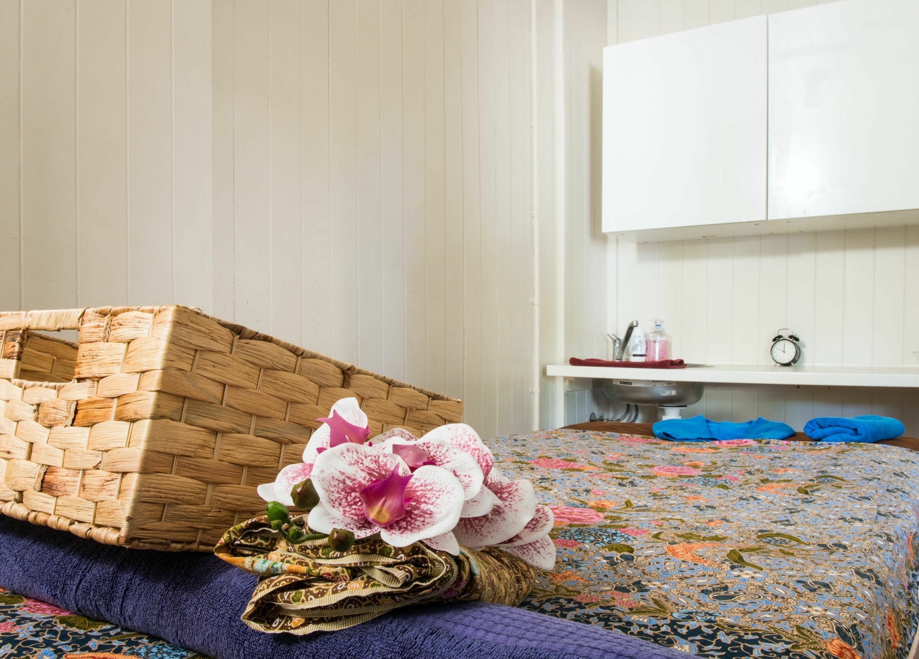 Peaceful treatment room at White Orchid Thai Day Spa (Toowong) with orchids in Toowong, Queensland, AU.