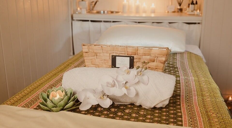 Relaxing massage table with orchids at White Orchid Thai Massage and Spa in Fortitude Valley, Queensland, AU.