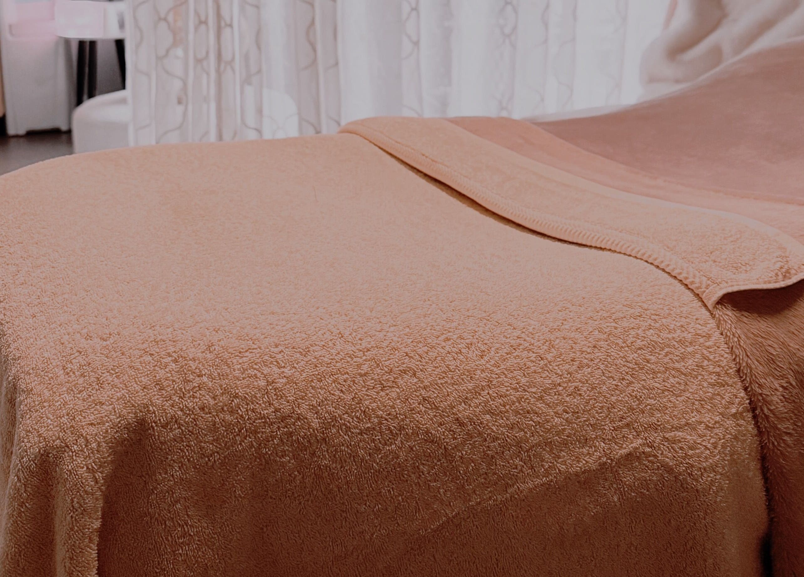 Cozy massage bed at Serene Skin & Body in Mount Hutton, New South Wales, AU, showing a relaxing setting.